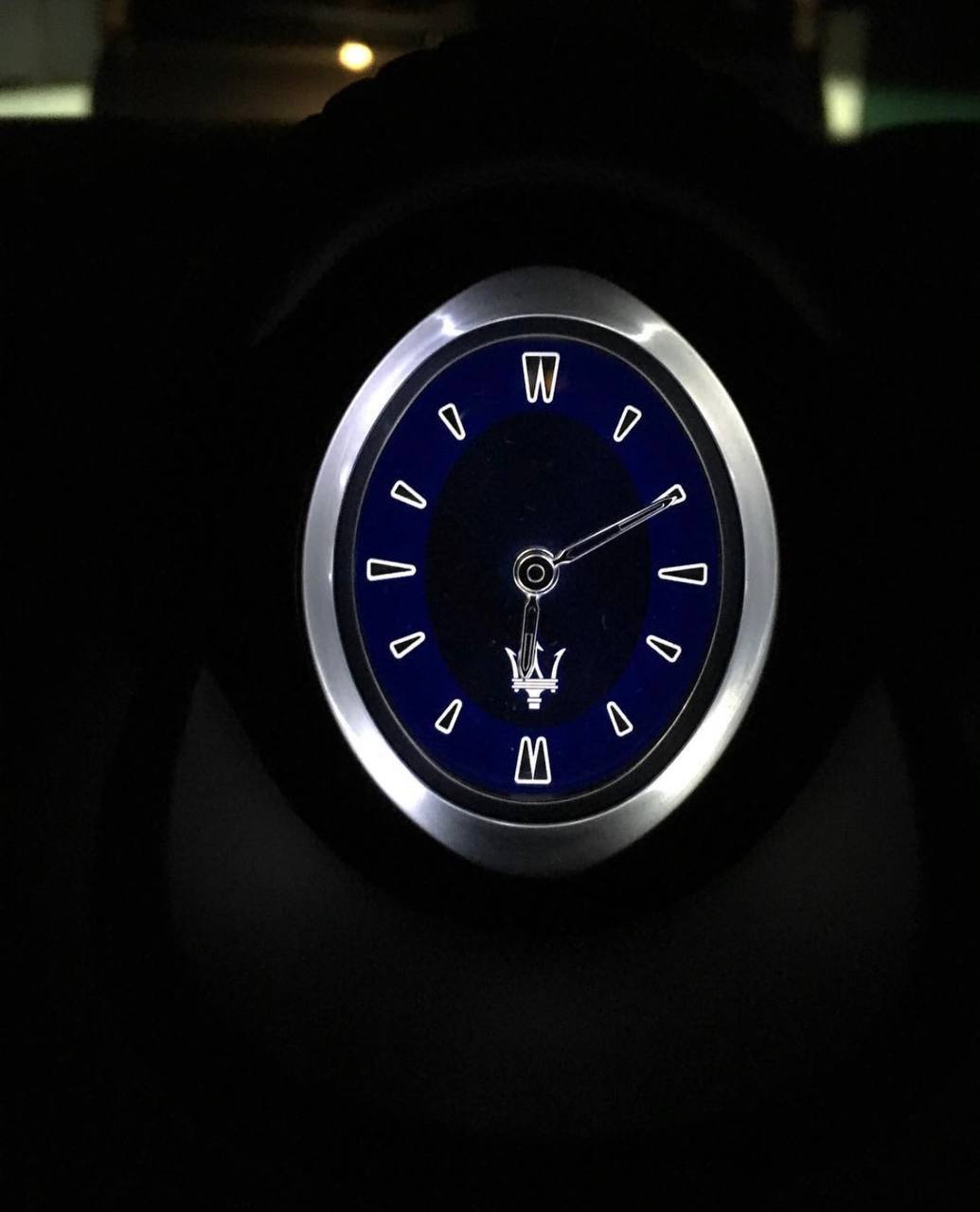 Close view of a blue oval luxury watch dial